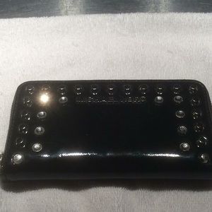 MK zip around wallet missing wrist strap.